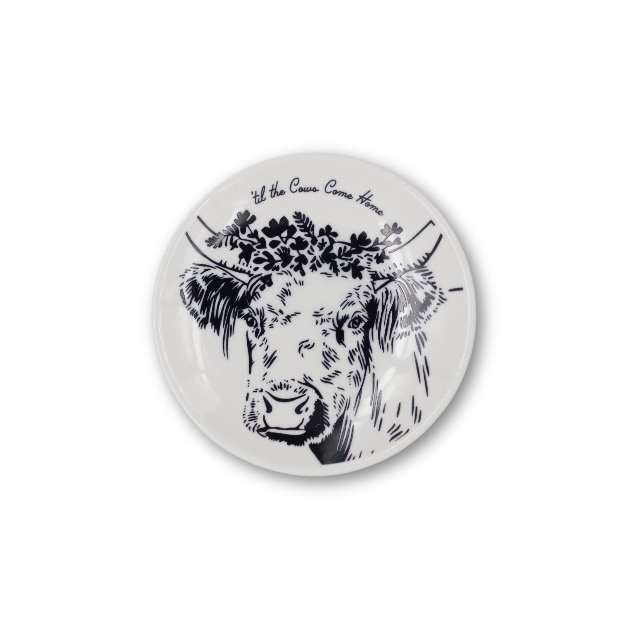 Small white plate with blue cow face